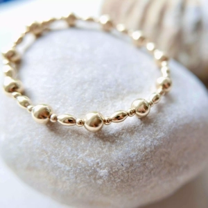 Bransoletka elastyczna złote kulki